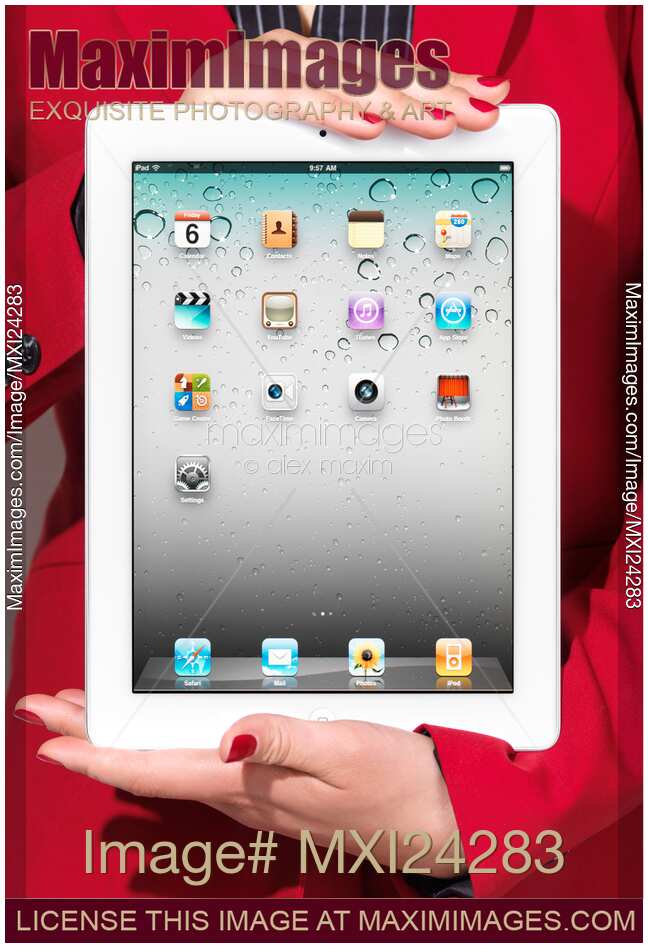 Woman in red business suit holding iPad in her hands