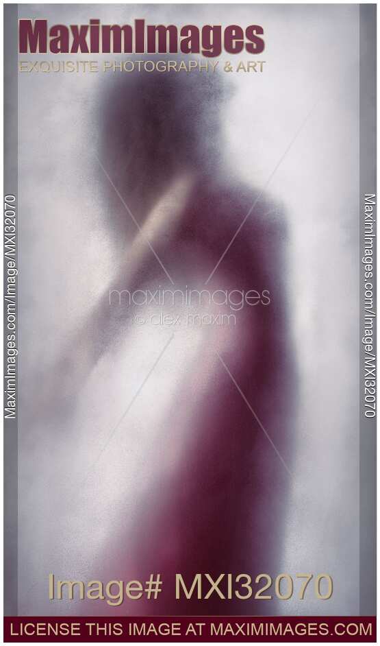 Woman in red dress graceful silhouette suspended in leaping motion behind a veil of bright white foggy haze