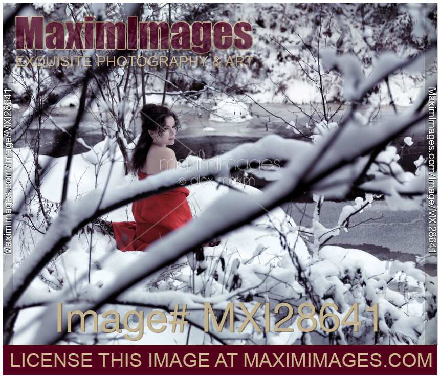 Woman in red kimono with bare shoulders in snow