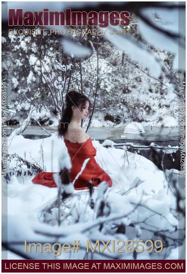 Woman in red kimono with bare shoulders in winter scenery
