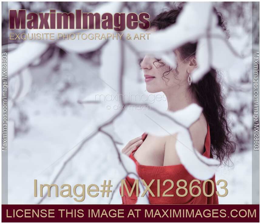 Woman in red kimono with bare shoulders in winter snow