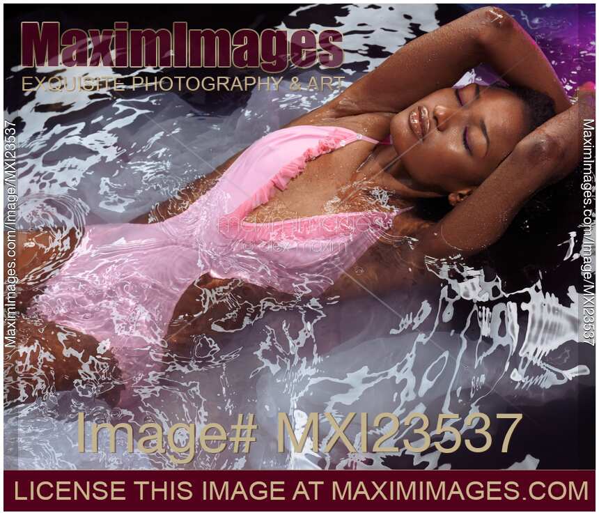 Woman in Swimsuit Lying in Water