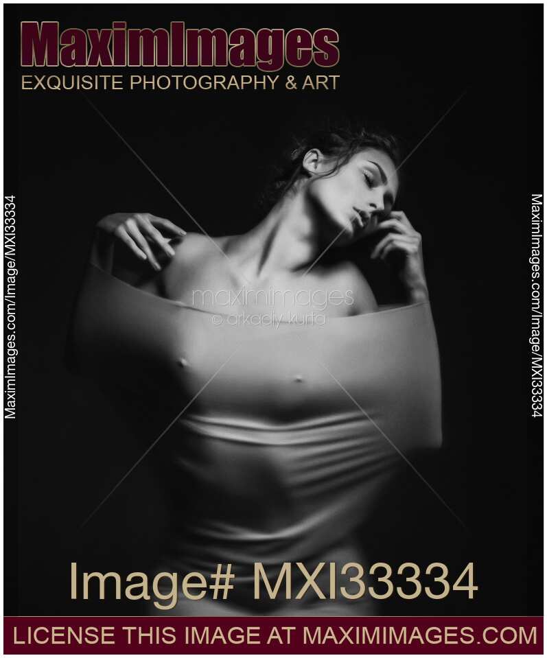 Woman in tight stretchy dress over naked body Black and white art nude dramatic portrait