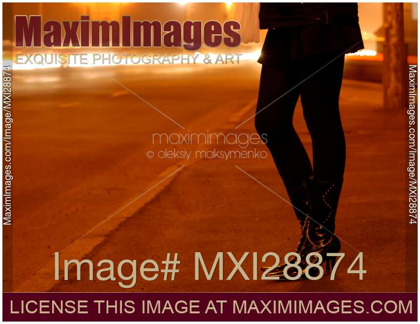 Woman Legs at Night on the Road