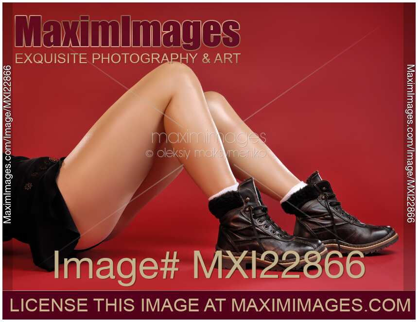 Woman Legs in Leather Boots