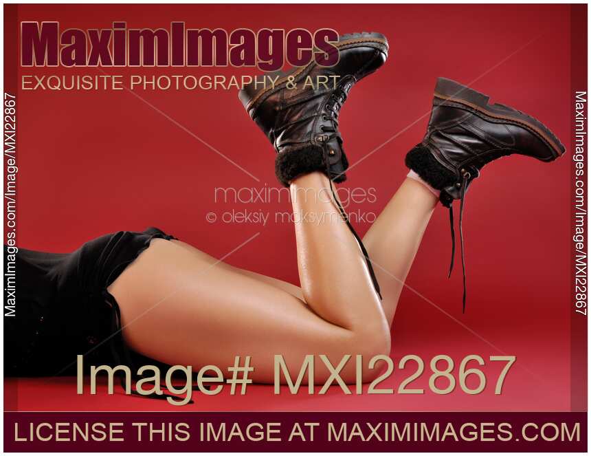 Woman Legs in Leather Boots