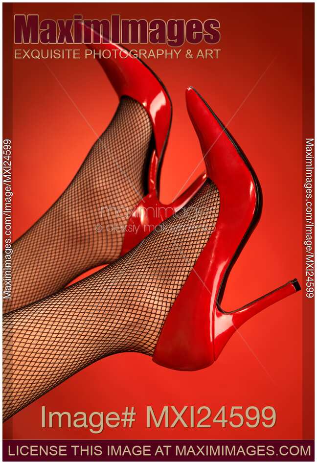 Woman legs in red high heel shoes up in the air