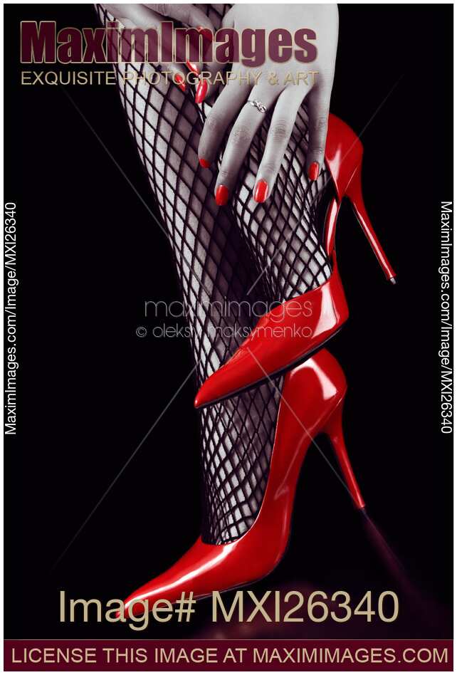 Woman legs in sexy red high heels and stockings