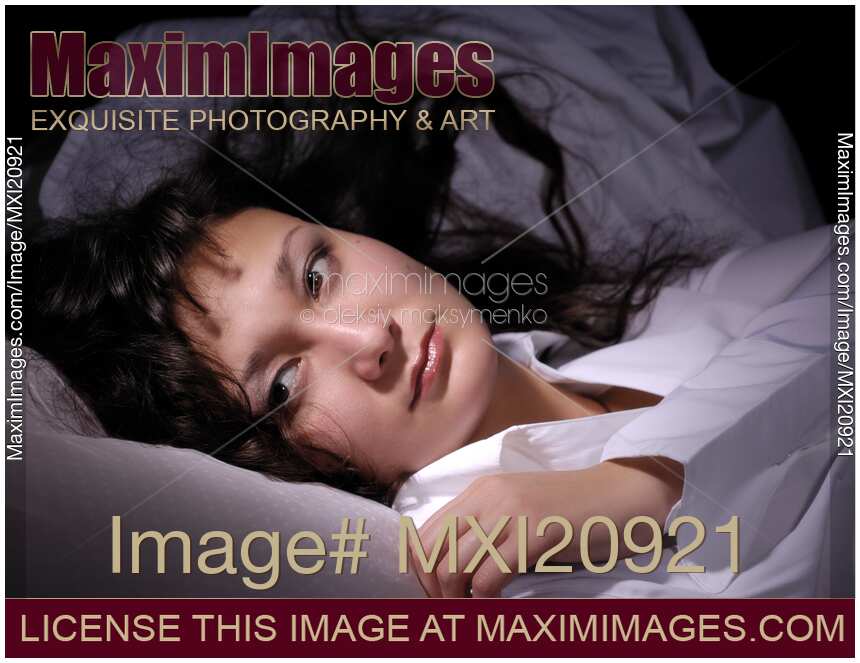 Woman Lying in Bed