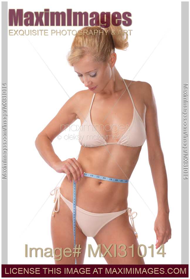 Woman Measuring Her Waist
