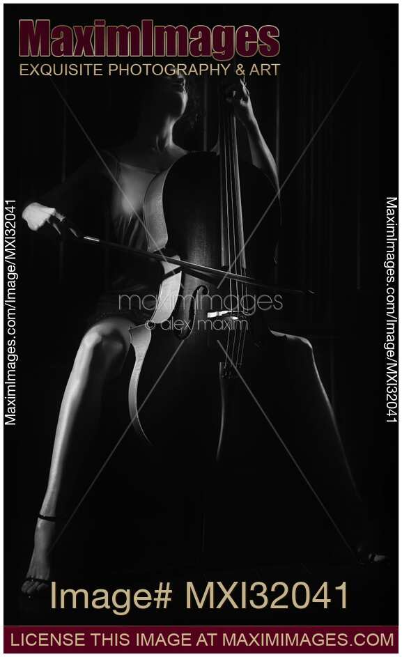 Woman passionately playing cello Dramatic dark contrast black and white portrait