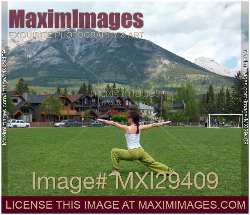 Woman practicing yoga in a park in Canmore Alberta
