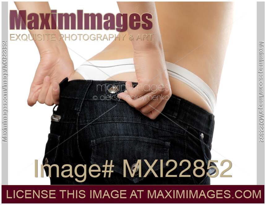 Woman pulling her jeans up