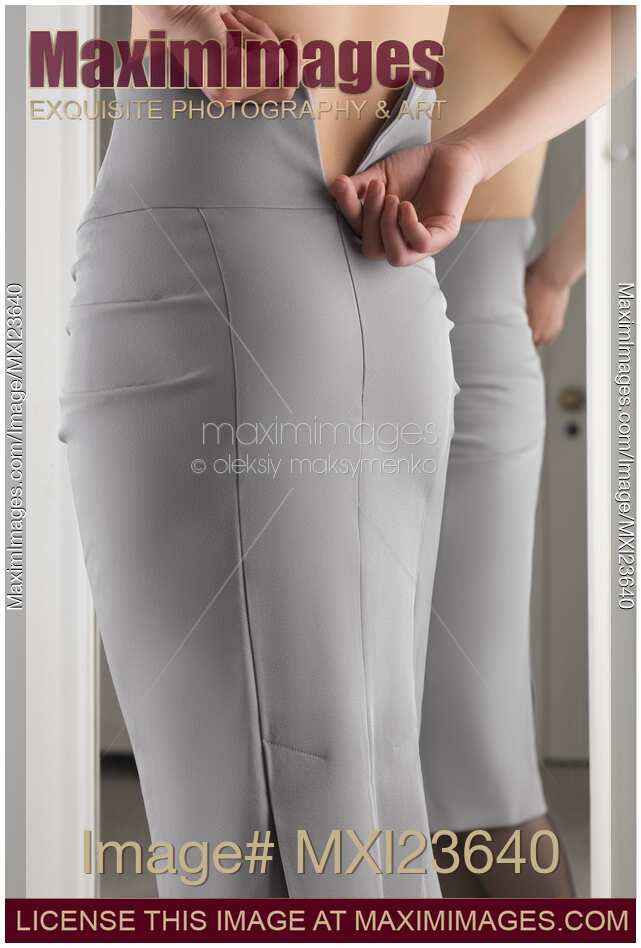Woman Putting On a Skirt