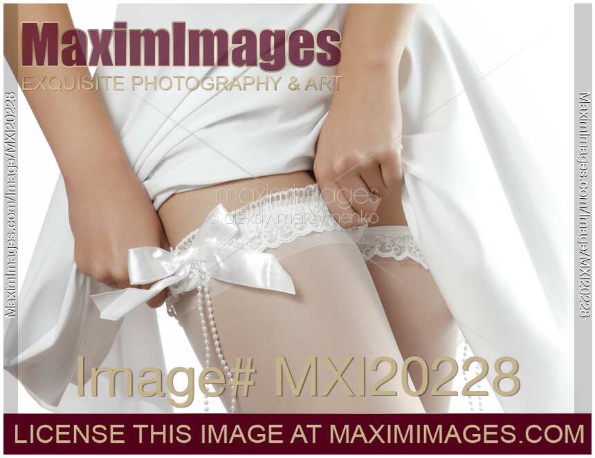 Woman Putting On White Stockings