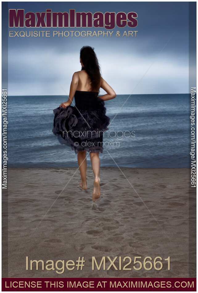 Woman running towards the shore