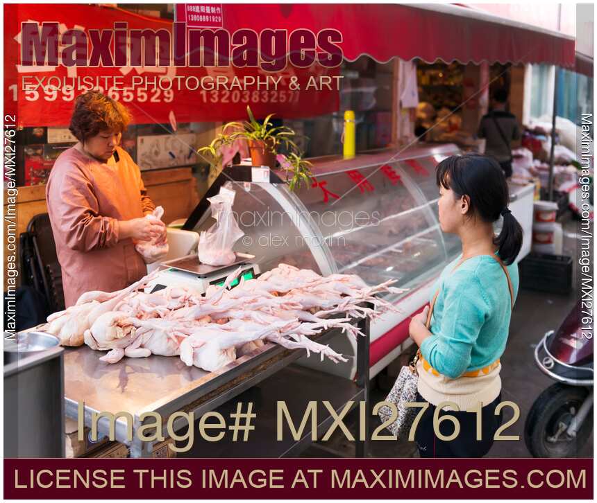 Woman selling chickens at the market