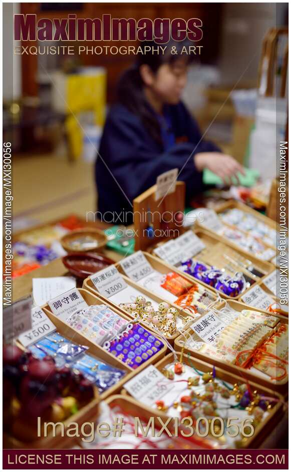 Woman selling fortune and good luck charms at Kiyomizu-dera temple in Japan