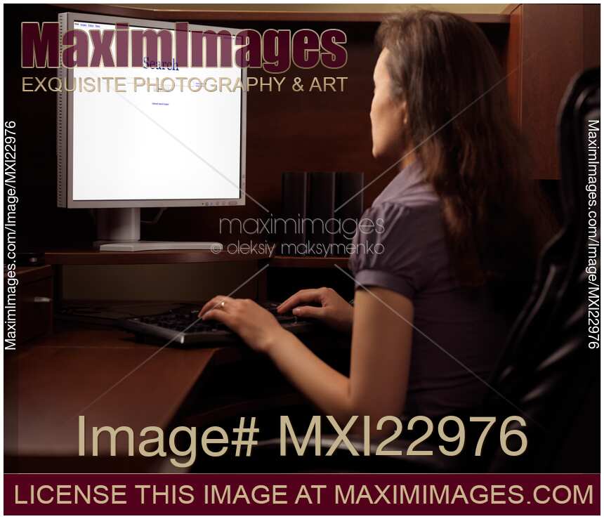 Woman Sitting in Front of a Computer