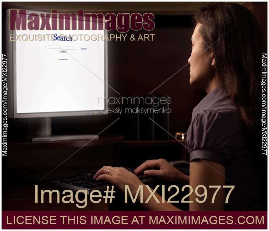 Woman Sitting in Front of a Computer