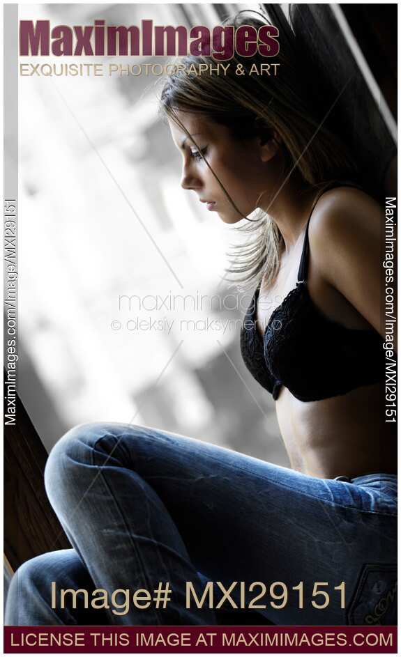 Woman Sitting on a Windowsill