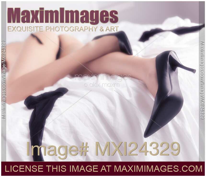 Woman sleeping in bed half naked