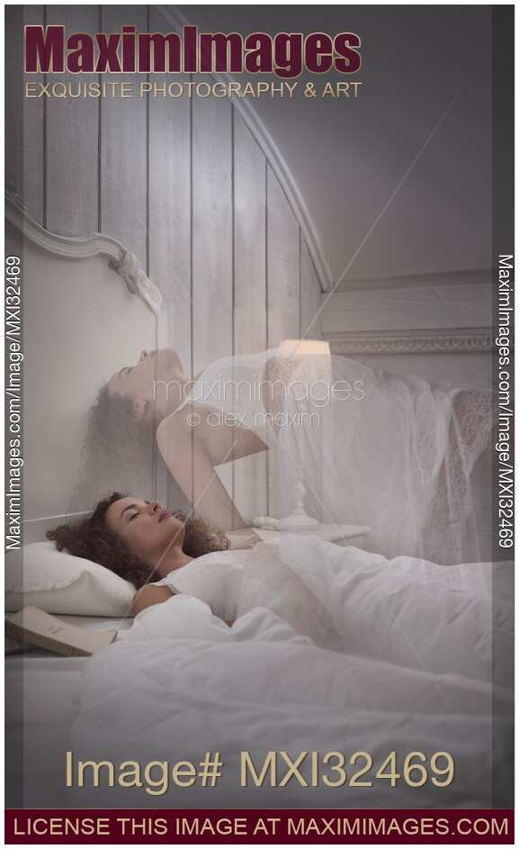 Woman sleeping in bed lucid dreaming her ethereal body rising above her
