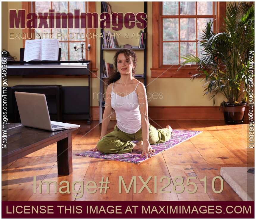 Woman taking a yoga break at home
