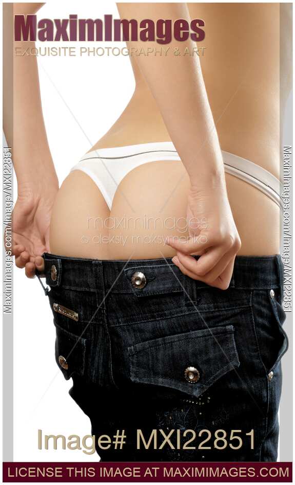 Woman trying to fit in her jeans