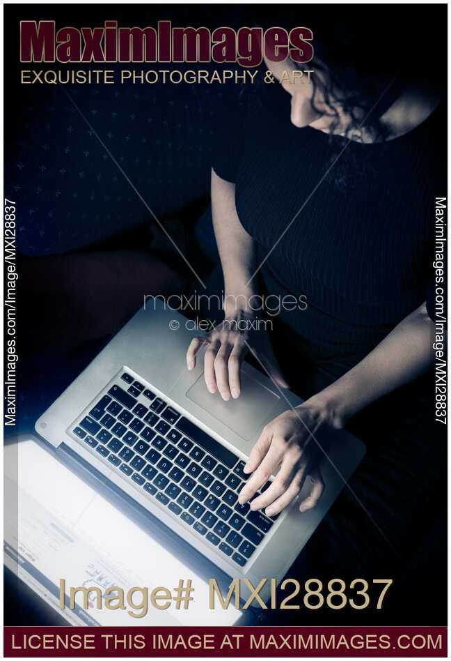 Woman using a laptop view from above
