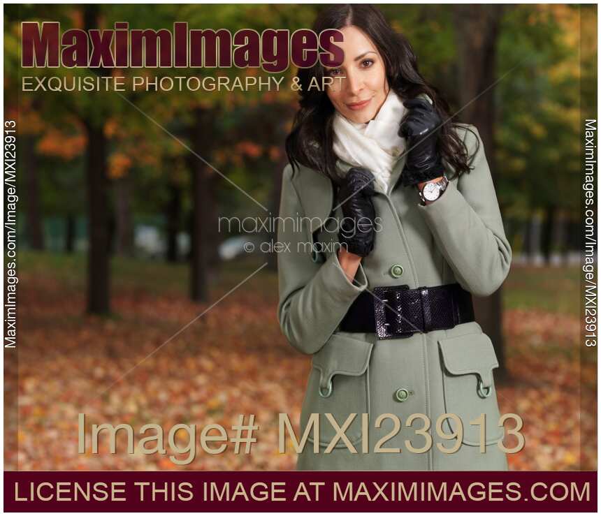 Woman Wearing a Green Coat in Fall