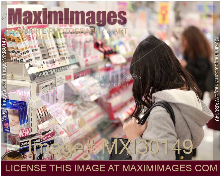 Women looking at the display of cosmetics in a Japanese makeup and beauty product store