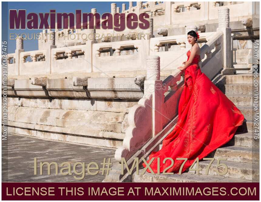 Young bride in red dress in China
