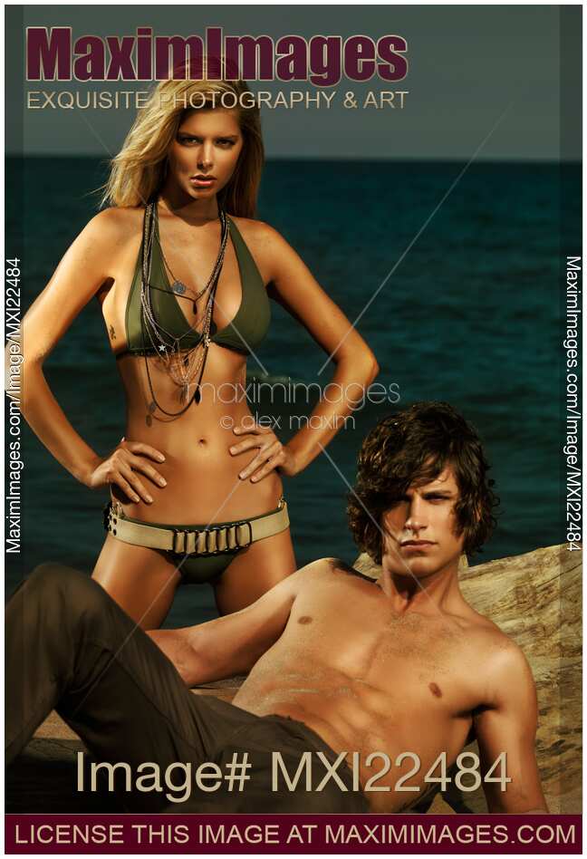 Young Couple in Army Style Clothing on the Beach