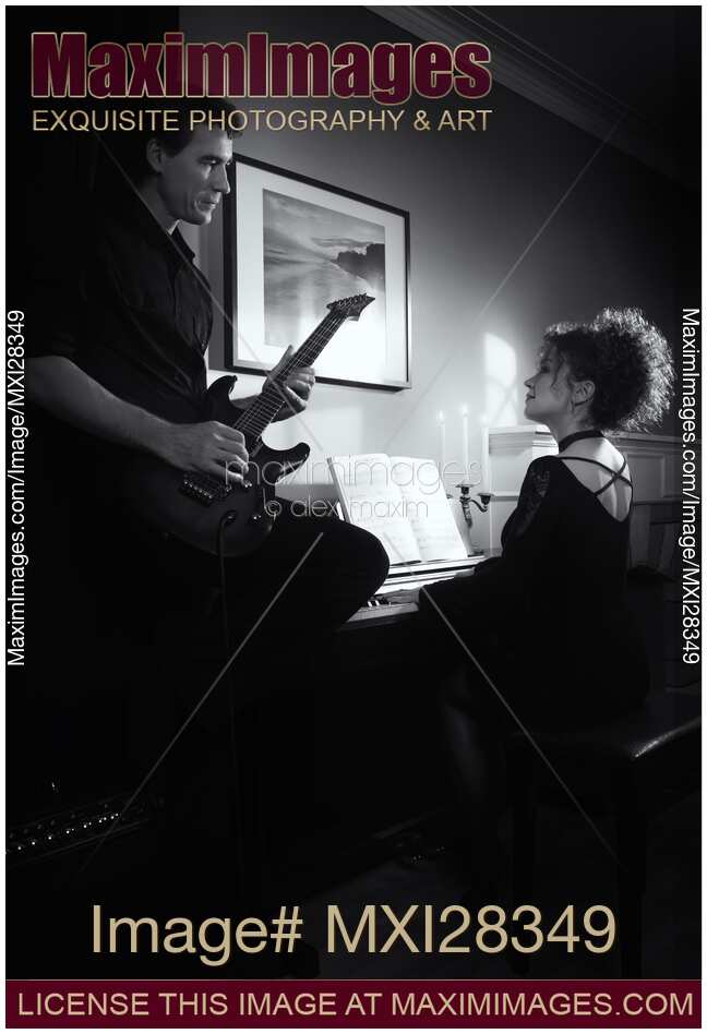 Young couple playing music Artistic black and white portrait