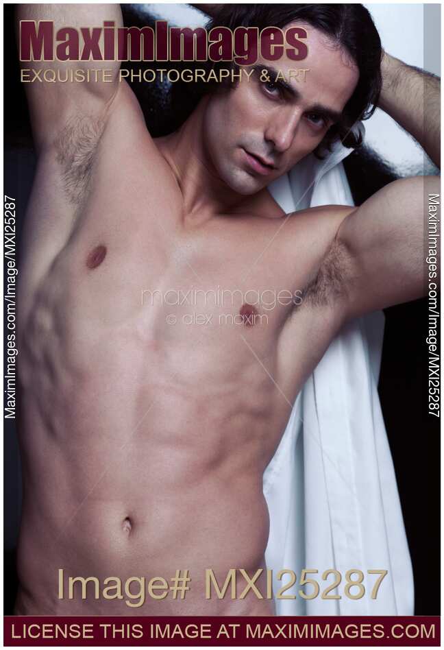 Young handsome man with long hair and sexy bare torso