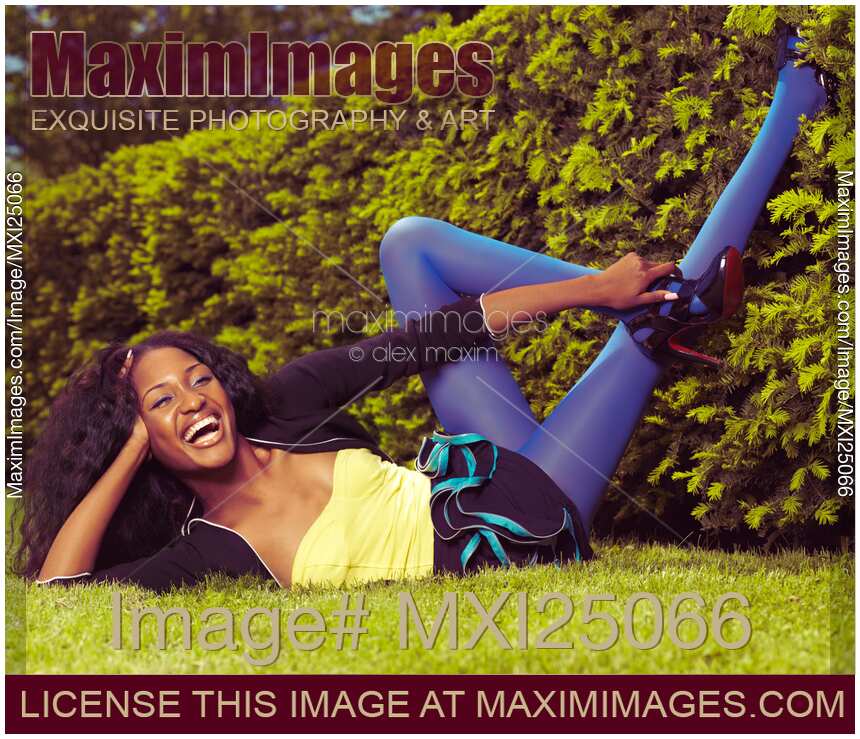 Young Happy Black Woman Lying on the Grass