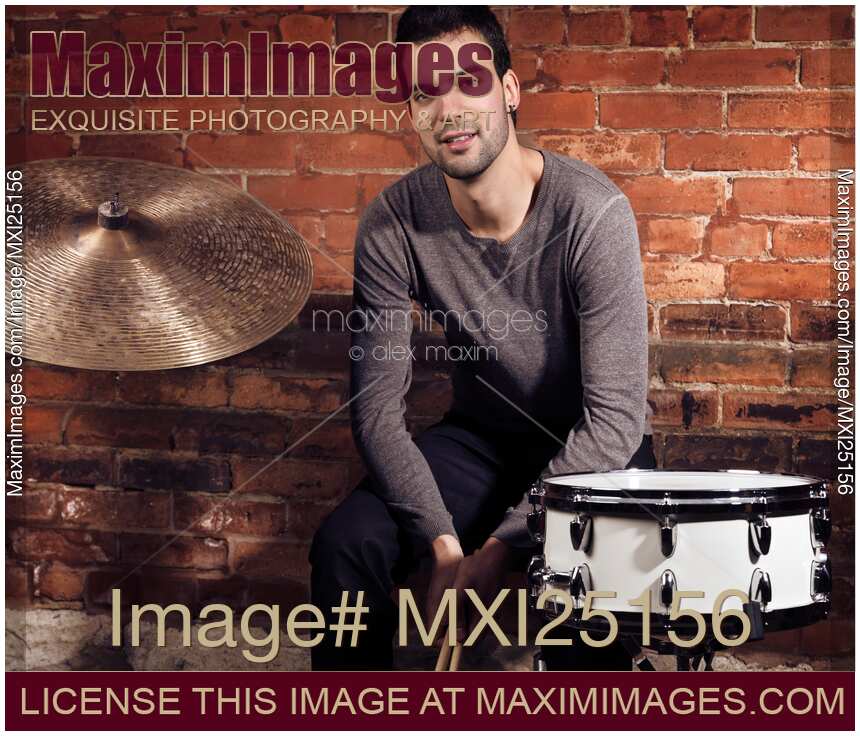 Young man drummer portrait