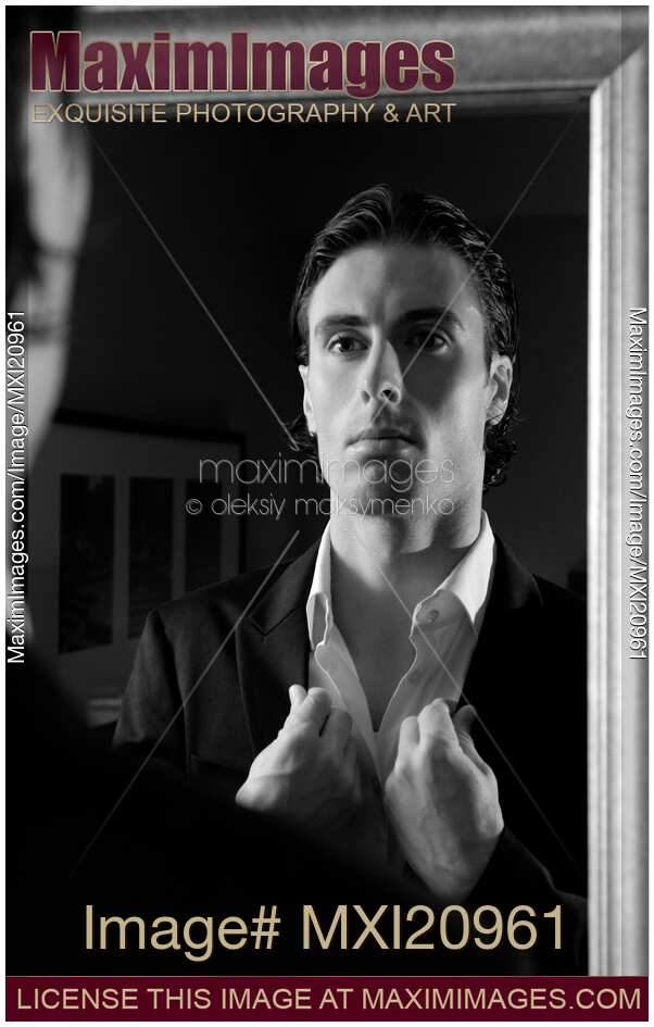 Young Man Looking at a Mirror