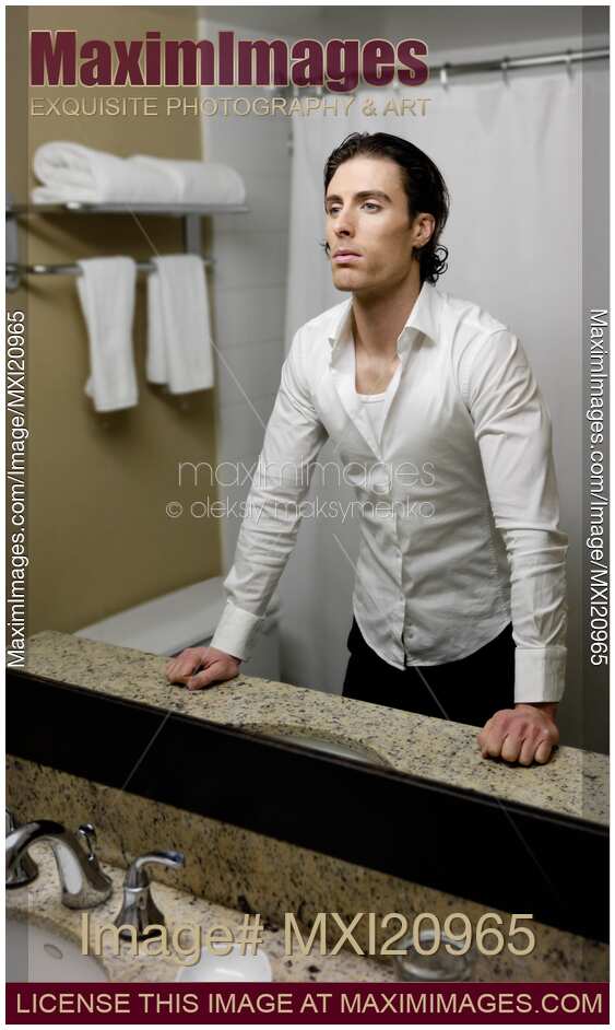 Young Man Looking at a Mirror