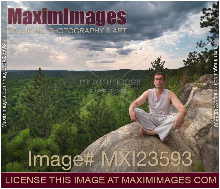 Young Man Meditating in the Nature
