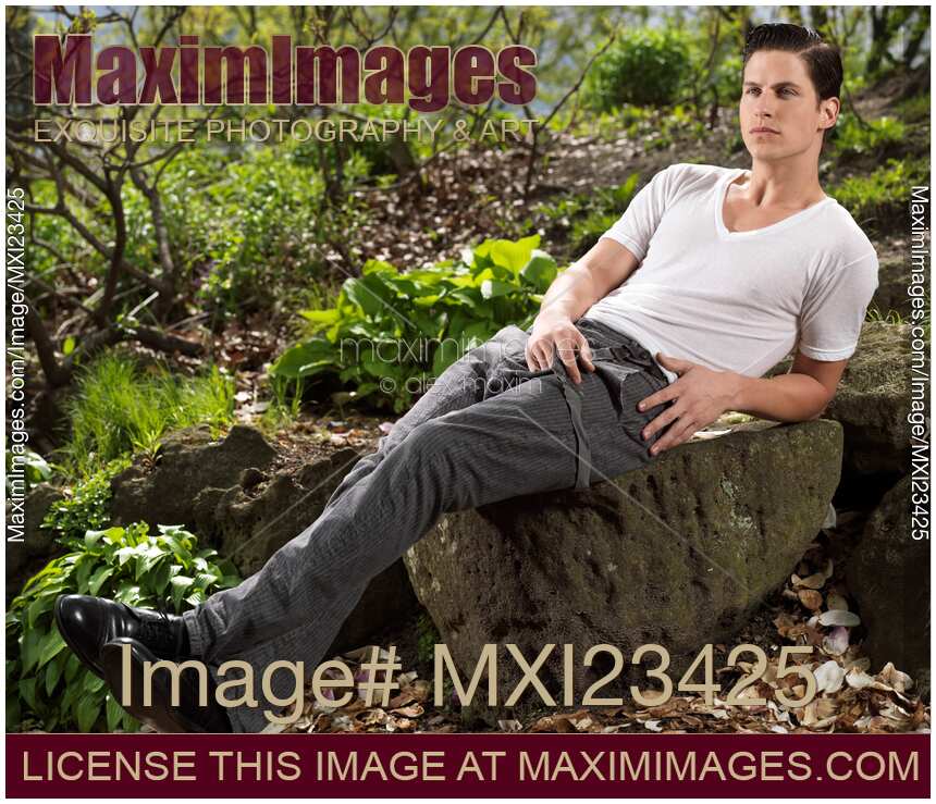 Young Man Sitting on a Rock