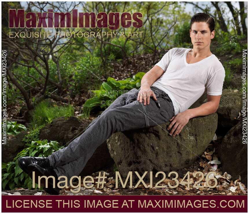 Young Man Sitting on a Rock