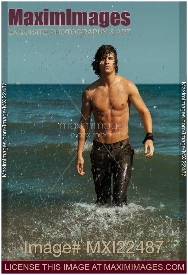 Young Man Walking Out of the Water