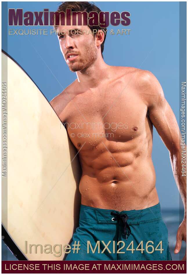 Young man with a surfboard