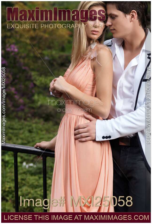 Young romantic couple embracing in a park