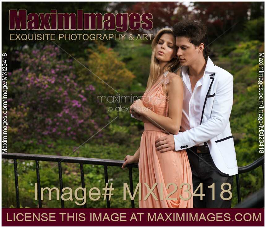 Young romantic couple embracing tenderly in a garden