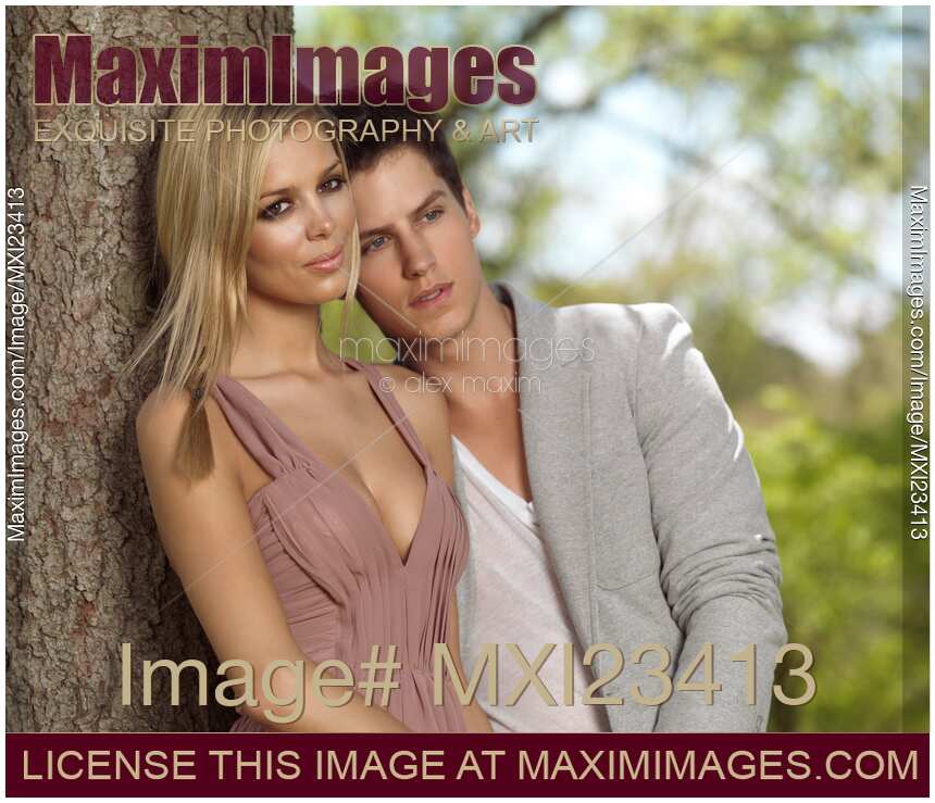 Young romantic couple in summer park