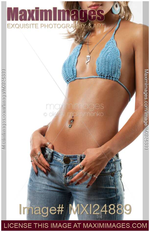 Young sexy woman in low rise jeans
