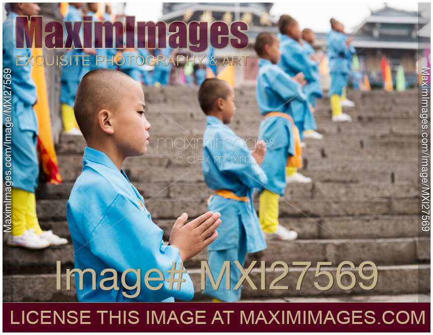 Young Shaolin students on the steps of their martial arts school in China